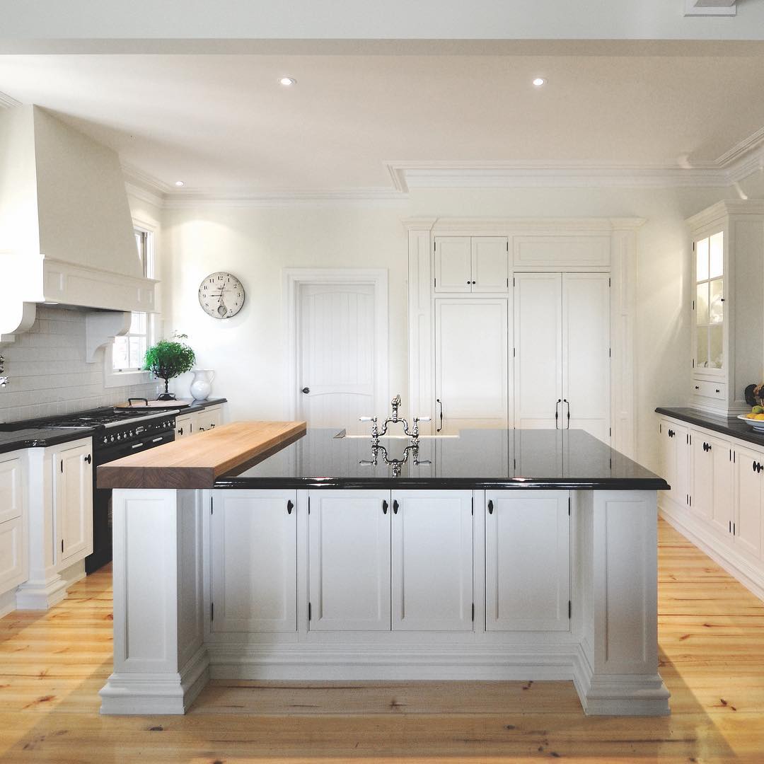 A fine farmhouse kitchen, one of our favourites. Custom  made with face frame cabinets, exposed hinges and traditional frame constructed shaker style doors. Custom made mantel and a huge solid timber chopping block.