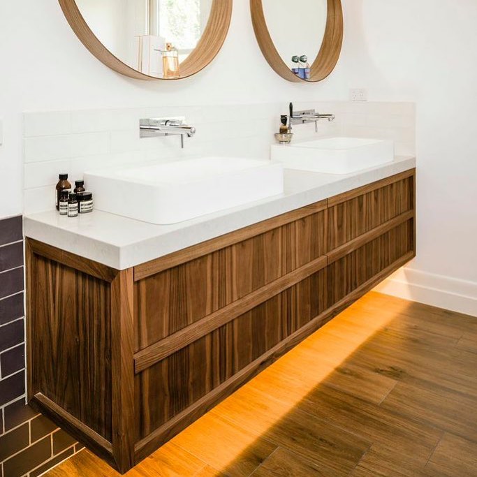 The client and I had a great time designing this stunning wall hung vanity unit. We decided on walnut veneer with solid walnut finger pull. Note he attention to detail with matched timber grain and feature lighting underneath.
.