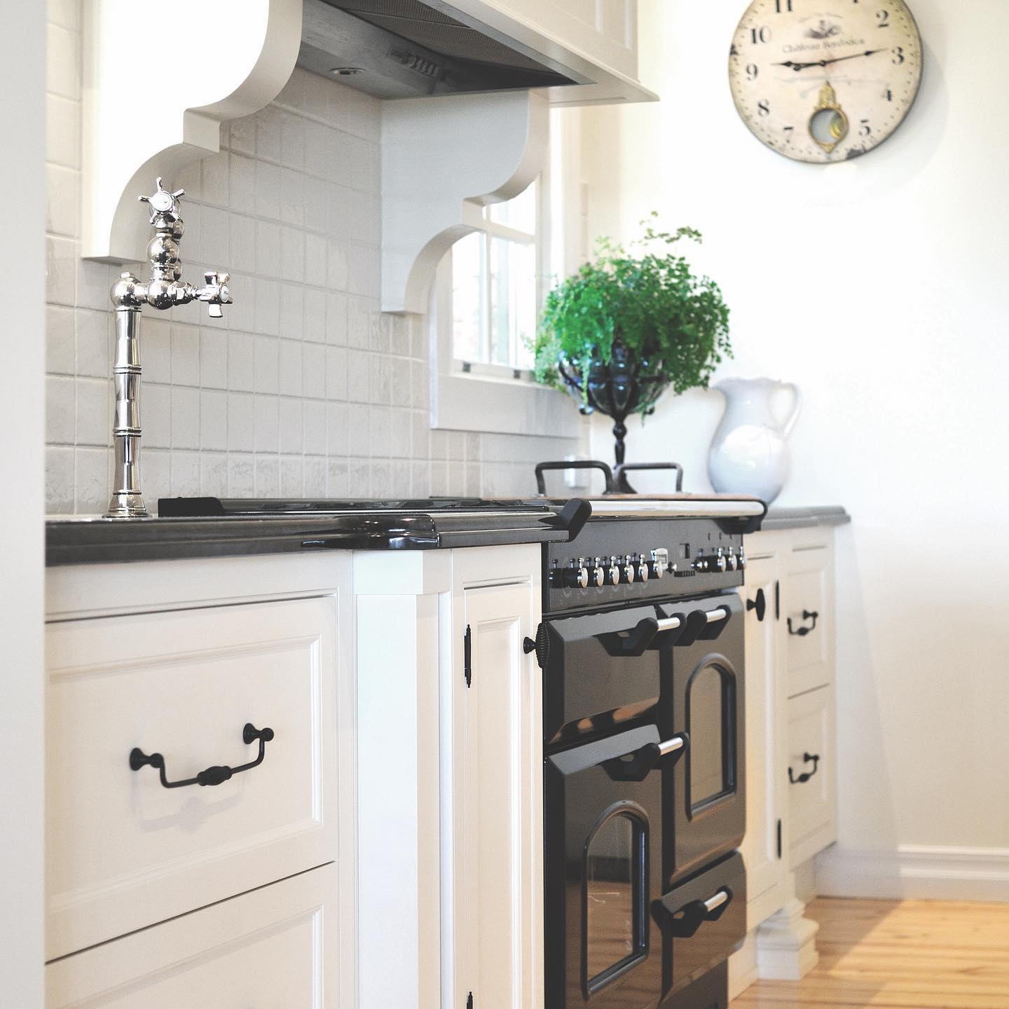 Still one of my all time favourites, just love this country style kitchen in Main Ridge Vic.
Loads of classical features, face frame cabinetry with exposed hinges and shaker doors with our Cumbria Hotham profile. 
Solid timber dove tail drawer boxes and a hand painted finish a testament to the craftsmanship in this project. Beautifully complimented by the swivel ball handles, and black knobs which really highlight the crisp white cabinets. 
You can’t go past the custom made canopy with hand made brackets to house the Qasair range. 
Nicolazzi country bridge mixer tap in the island and pot filler located conveniently next to the Falcon Classic freestanding cooker. 
For more information visit our Website at www.steding.com.au or contact our office on 0397483800 to arrange a design consultation. .
.
.
.
.