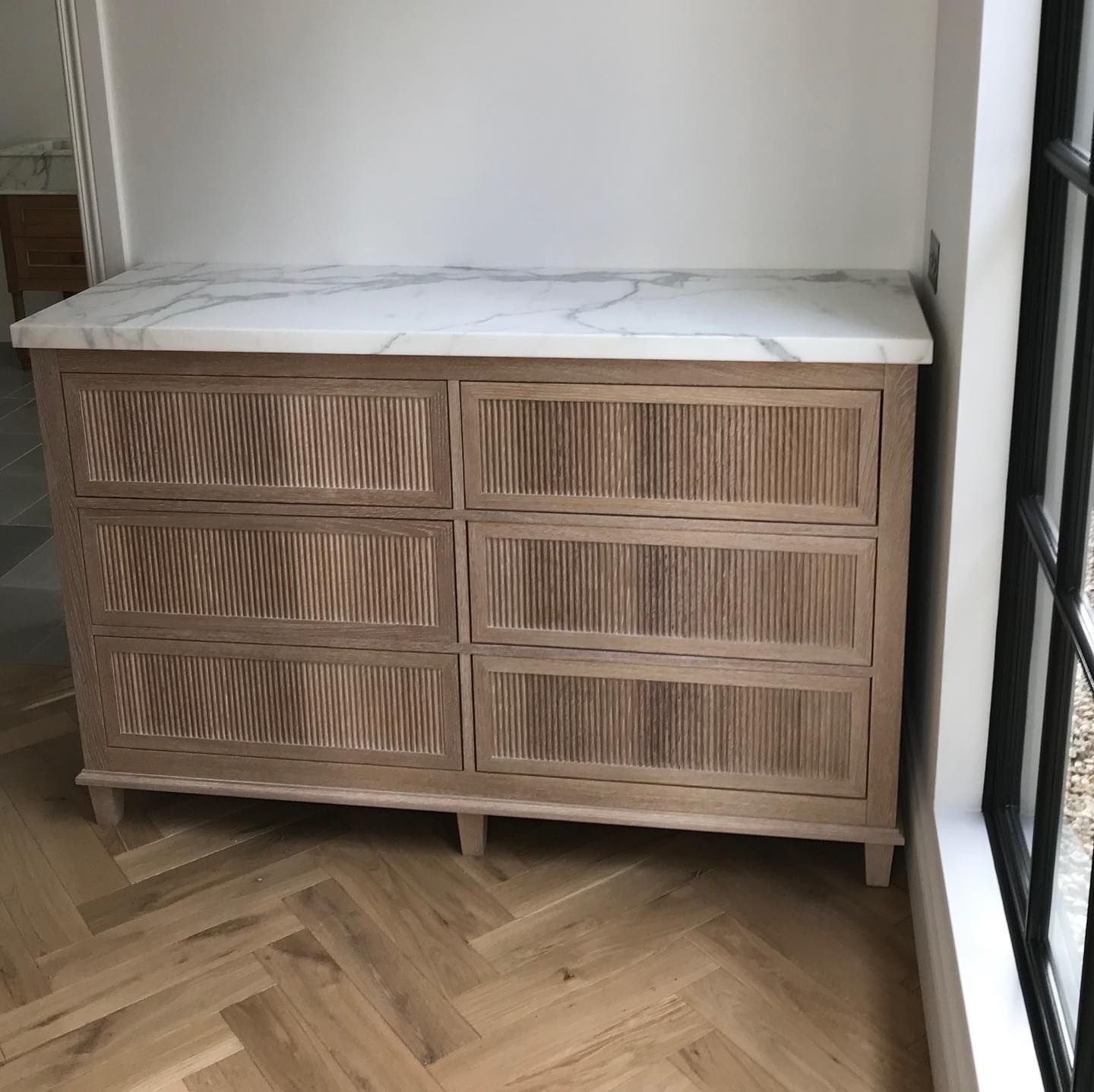 Custom made American Oak dresser with a reeded profile and lime wax finish. A lovely piece of handcrafted furniture  by Steding Interiors &Joinery. 
.
.
.
.
.